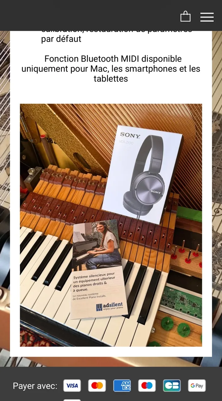 Système adsilent installé dans un piano, avec casque et documentation